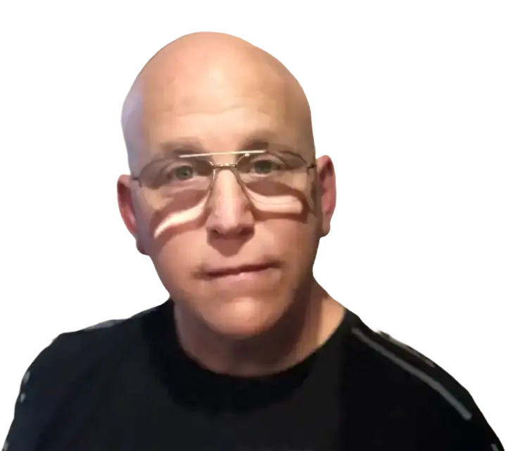 Portrait of William Strauss, wearing glasses and a dark shirt, looking directly at the viewer